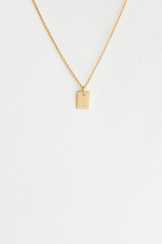 Memento diamond and 9k gold charm by Charlotte Penman